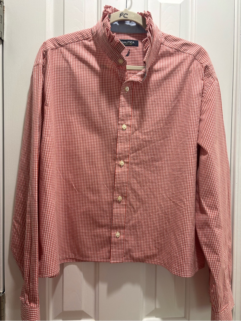 Nautica a repurposed man’s dress shirt into a ladies ruffled blouse